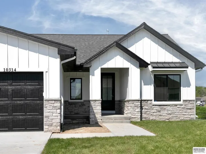 Modern farmhouse front with stone accents