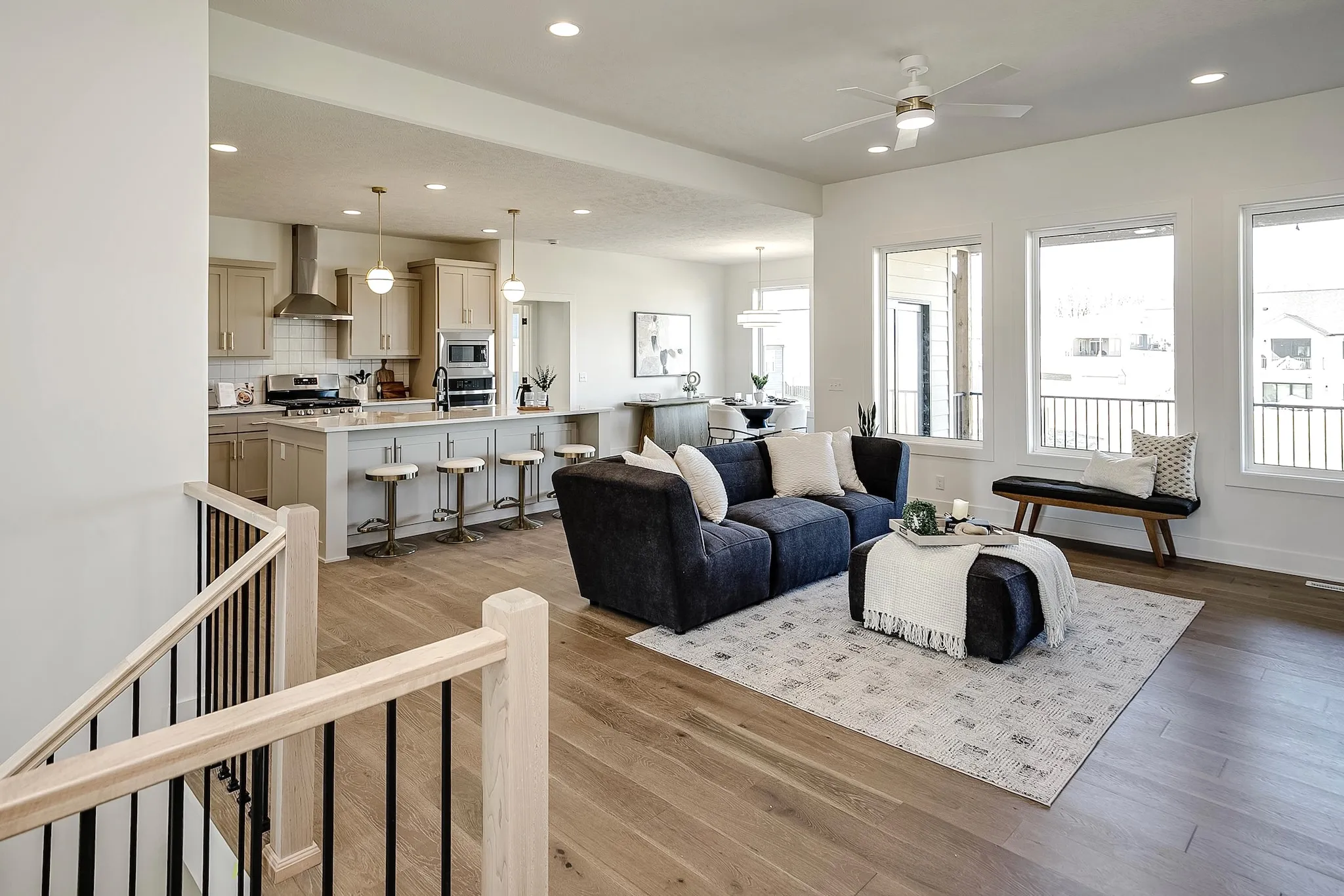 Open-concept living room with staircase
