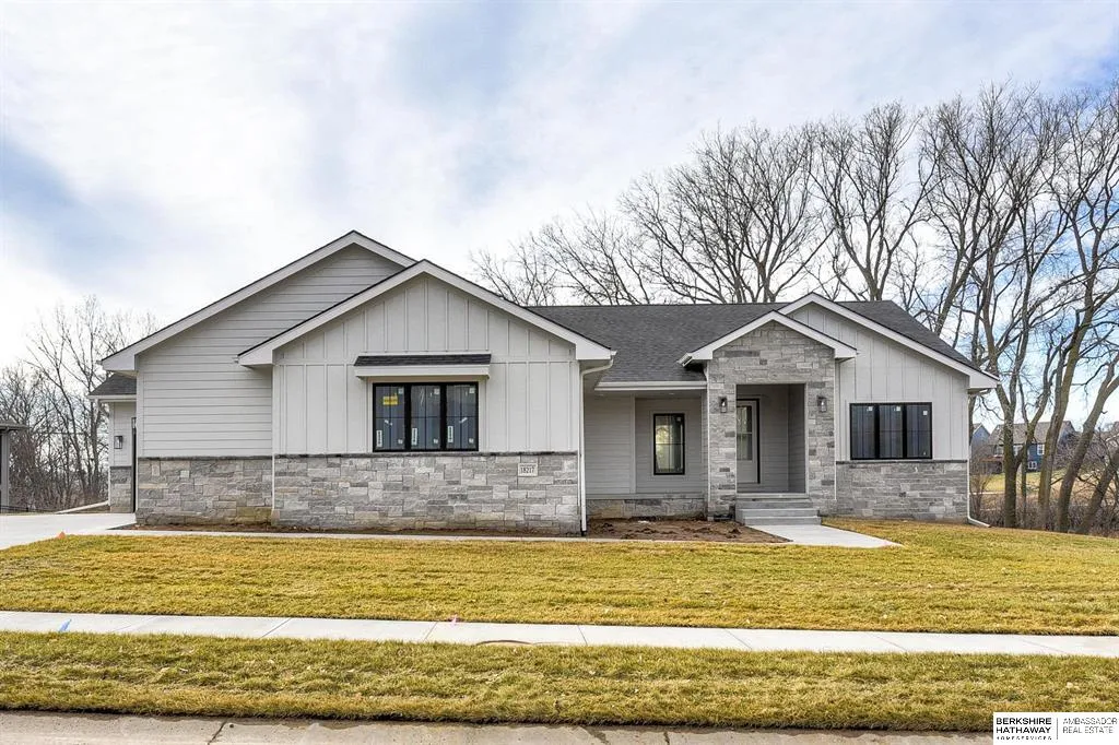 Danielson home with a stone front and covered entry
